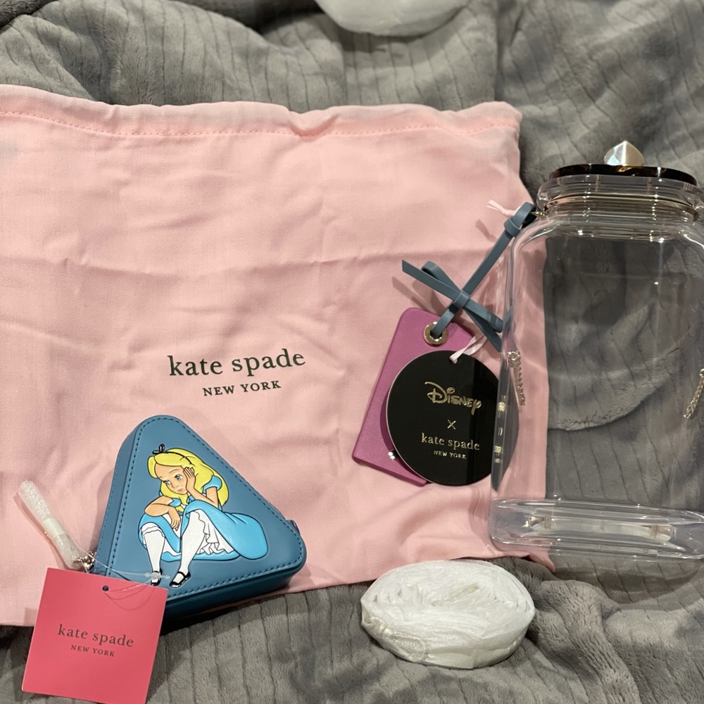 Kate Spade New York Alice in wonderland crossbody purse.